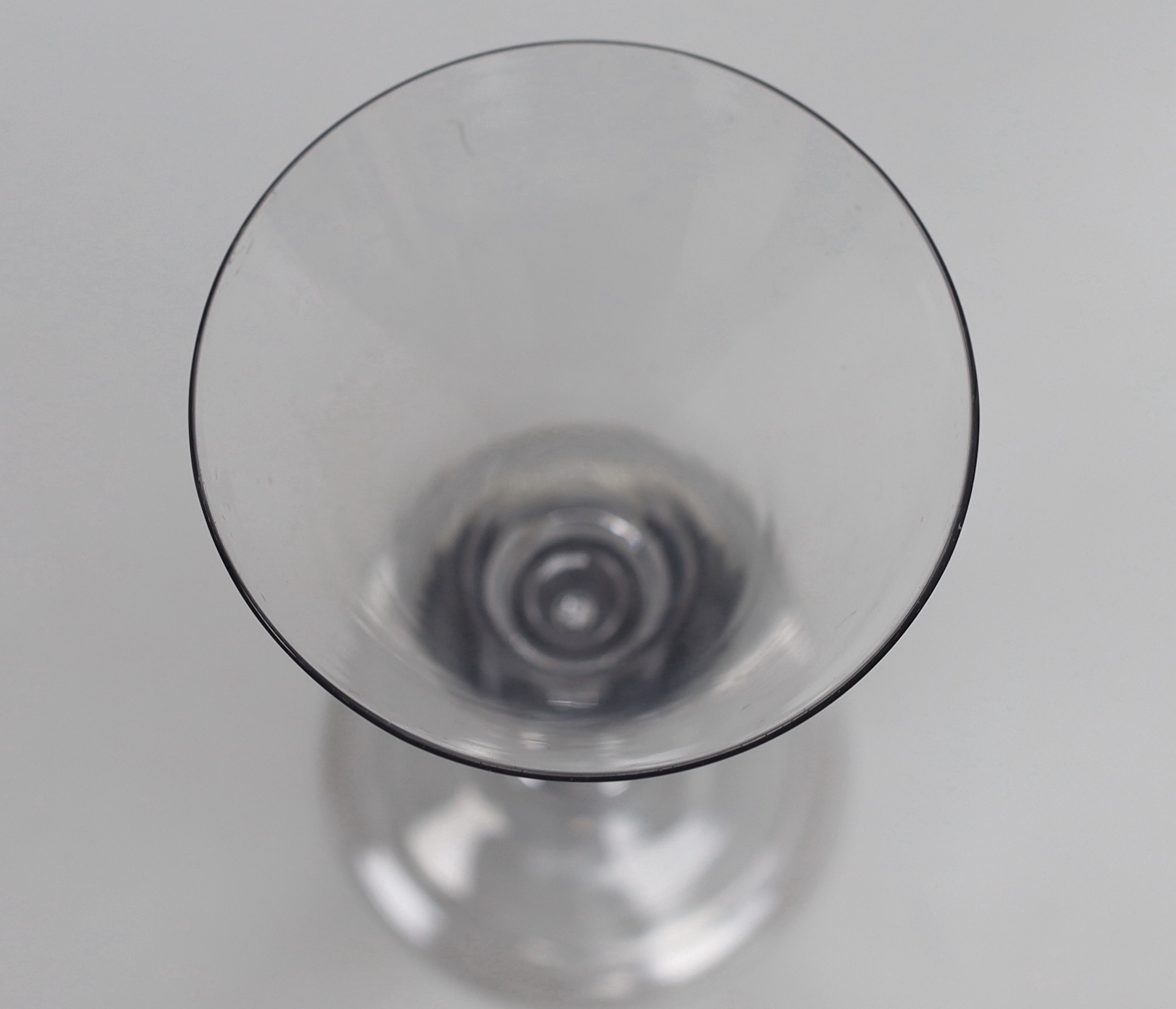 An English Georgian lead crystal mammoth drawn trumpet goblet, with good tear in the stem, folded foot and rough pontil, 21.6cm high